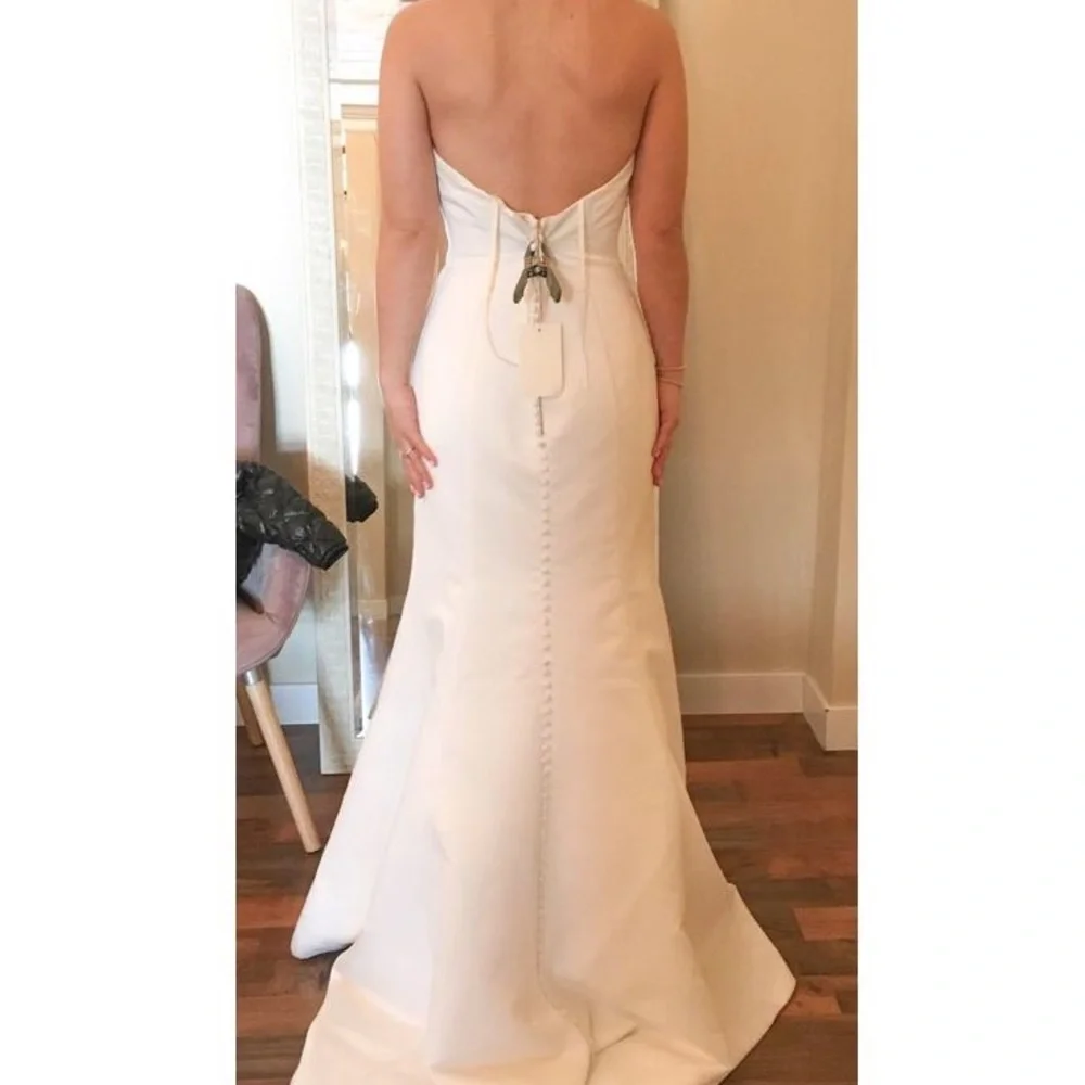 BHLDN Strapless White Mermaid Wedding Gown with Covered Buttons